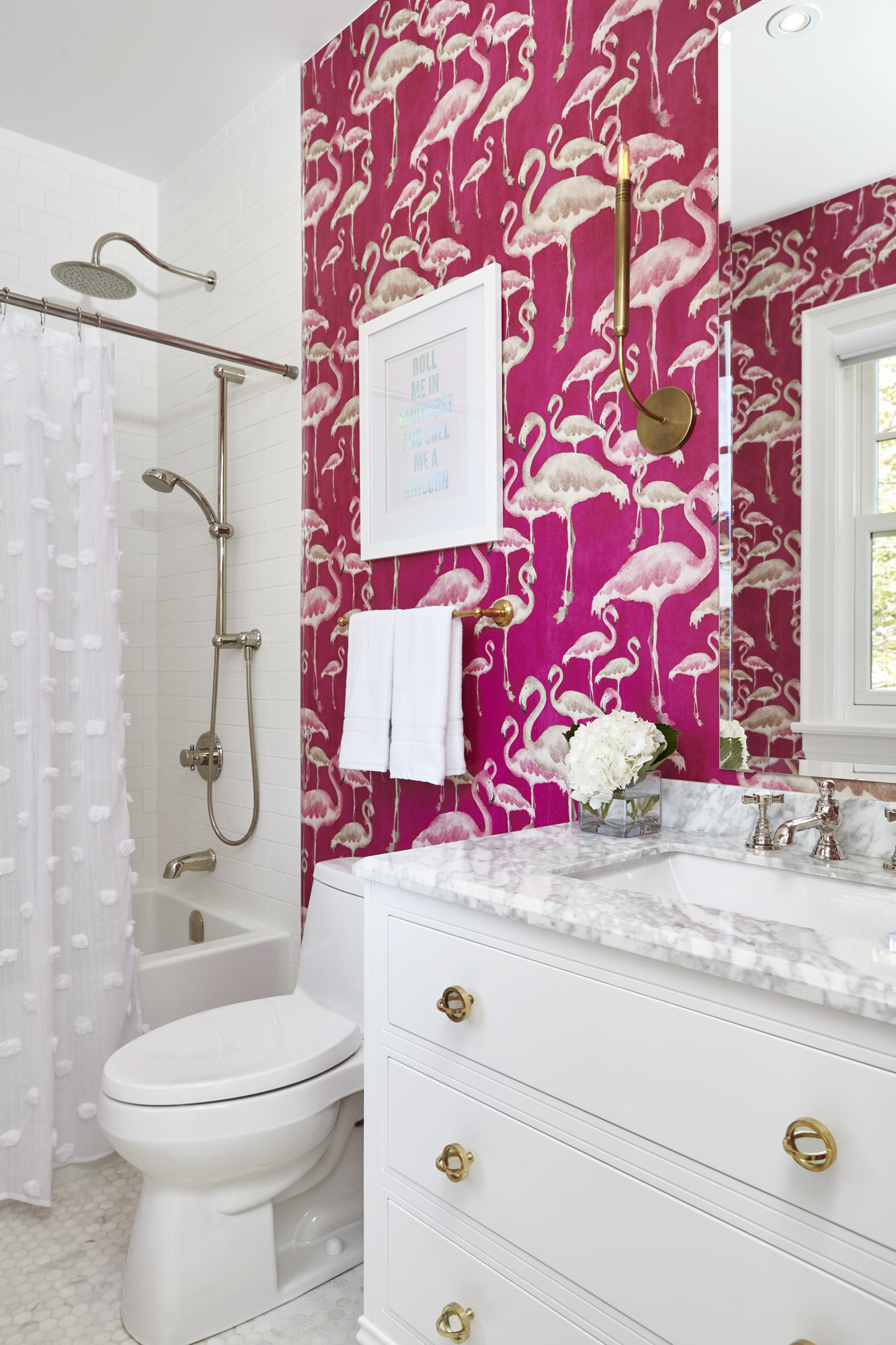 Flamboyant flamingos hang out in the ensuite bathroom. 